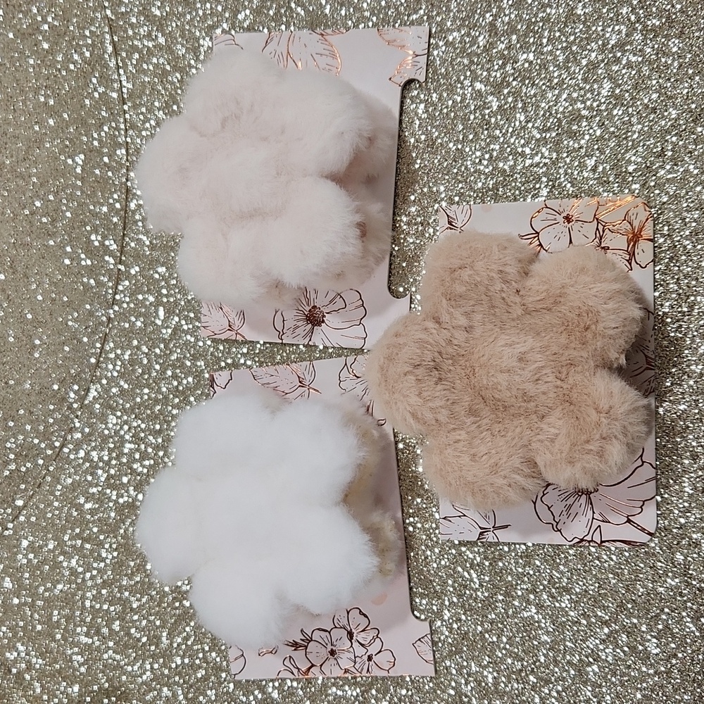 Fuzzy flower hair clips. White, tan or beige.